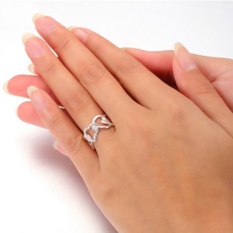 Bague or blanc diamants en forme de succession de coeurs