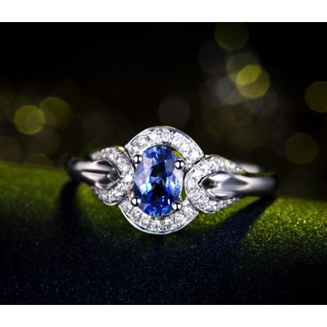 Bague fiançailles saphir diamants et or blanc. Motifs bouclés
