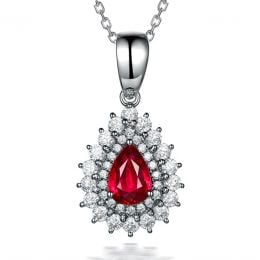 Pendentif rubis rouge vif taillé poire. Diamants sertis et Or blanc