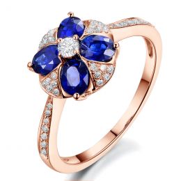 Bague solitaire fleur bleue. Or rose, saphirs et diamants