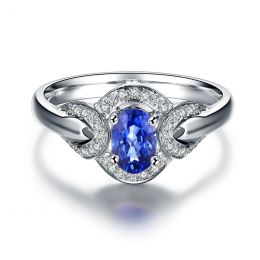 Bague fiançailles saphir diamants et or blanc. Motifs bouclés