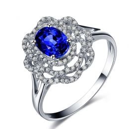 Bague fiancailles saphir bleu diamants. Or blanc, fleur éclose