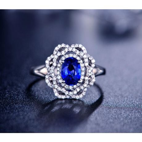 Bague fiancailles saphir bleu diamants. Or blanc, fleur éclose