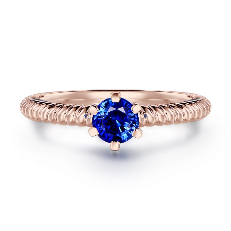 Bague or rose monture torsadée. Saphir bleu 0.55ct - 1