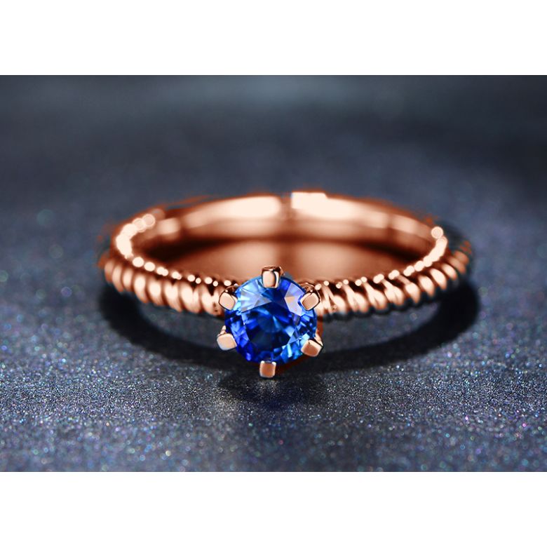 Bague or rose monture torsadée. Saphir bleu 0.55ct - 3